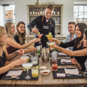 group of friends around a table enjoying a cocktail making class